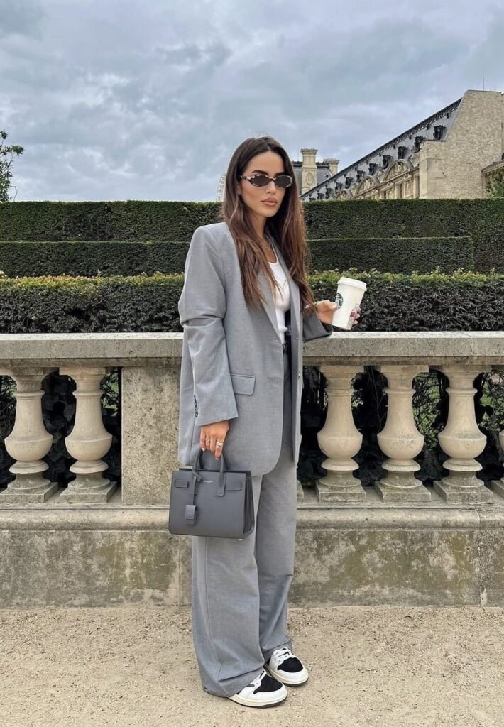 Grey Oversized Suit + White T-Shirt + Wide-Leg Trousers + Black-and-White Sneakers + Structured Grey Tote