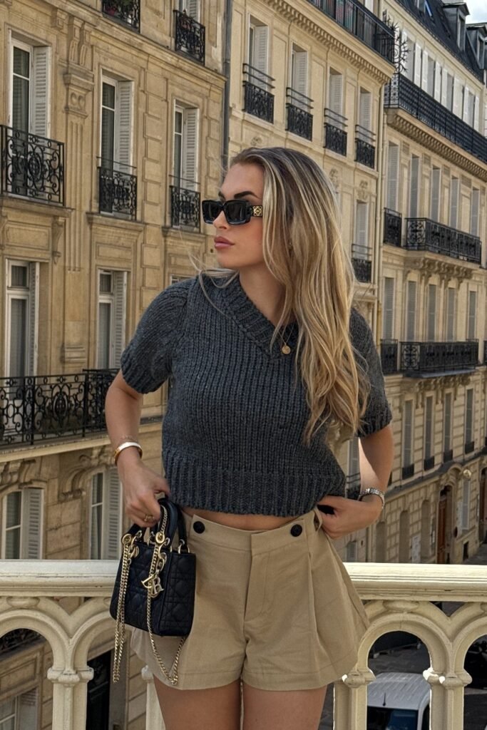 Grey Short-Sleeve Knit Sweater + Beige High-Waist Shorts + Black Mini Handbag with Gold Chain