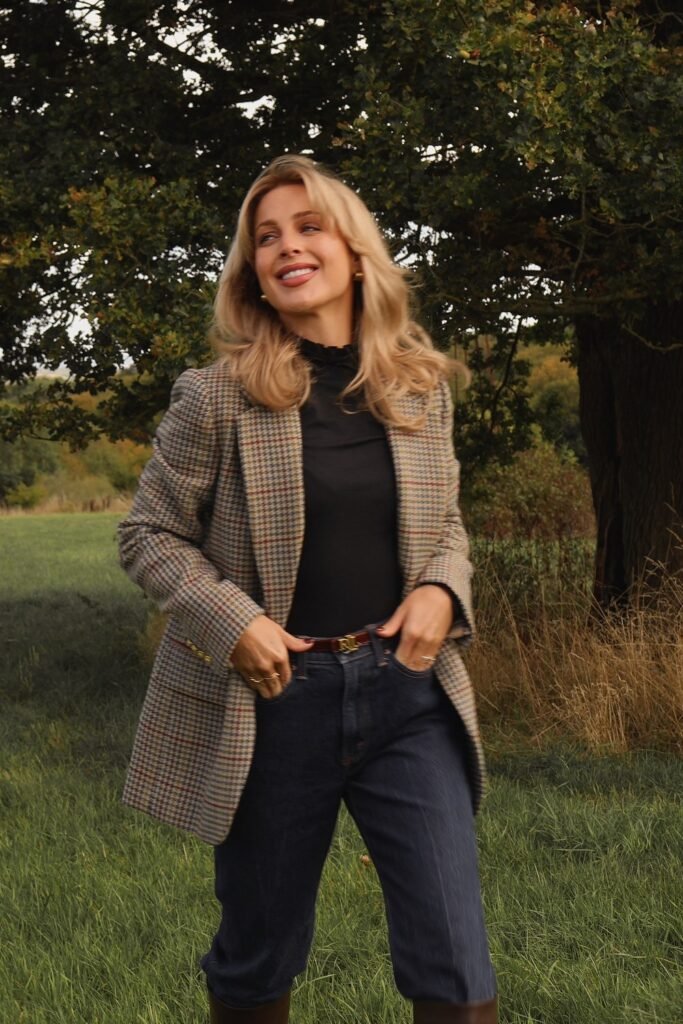 Houndstooth Blazer + Black High-Neck Top + Dark Denim Jeans + Brown Belt