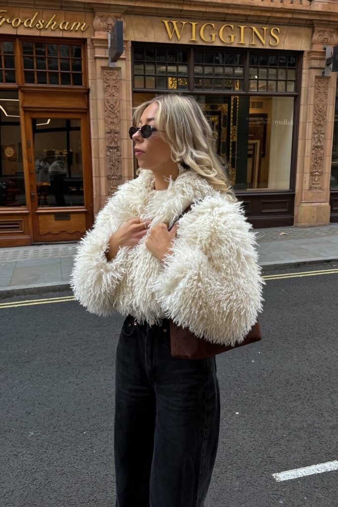 White Faux Fur Jacket + Black Jeans + Brown Shoulder Bag