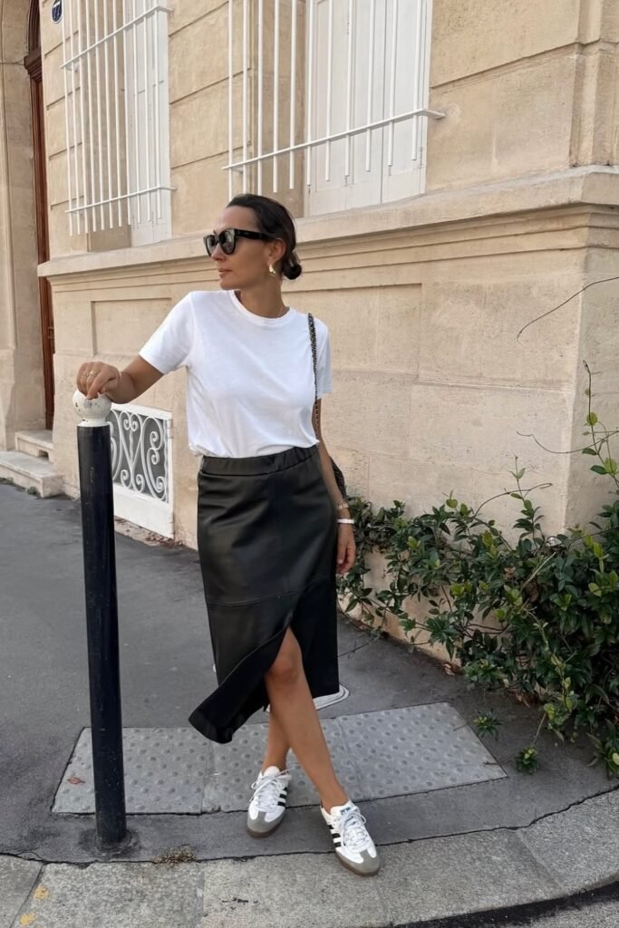 White T-Shirt + Black Leather Skirt + Classic Sneakers