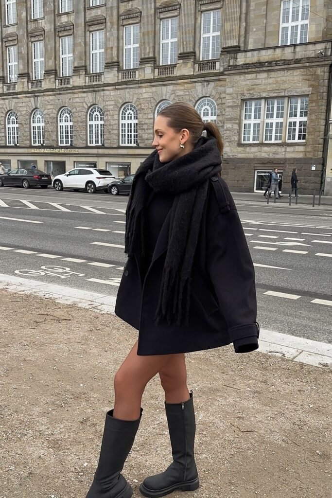 All-Black Oversized Coat + Chunky Scarf + Knee-High Boots