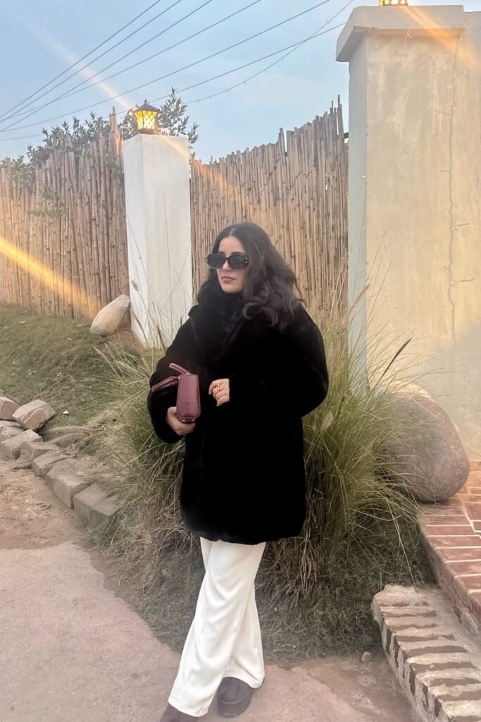 Black Faux Fur Coat + White Wide-Leg Pants + Burgundy Clutch