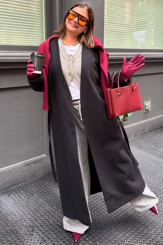 Black Long Coat + Grey Cardigan + White Top + Grey Wide-Leg Pants + Burgundy Sweater Draped Over Shoulders + Burgundy Gloves + Burgundy Handbag + Burgundy Pointed Heels