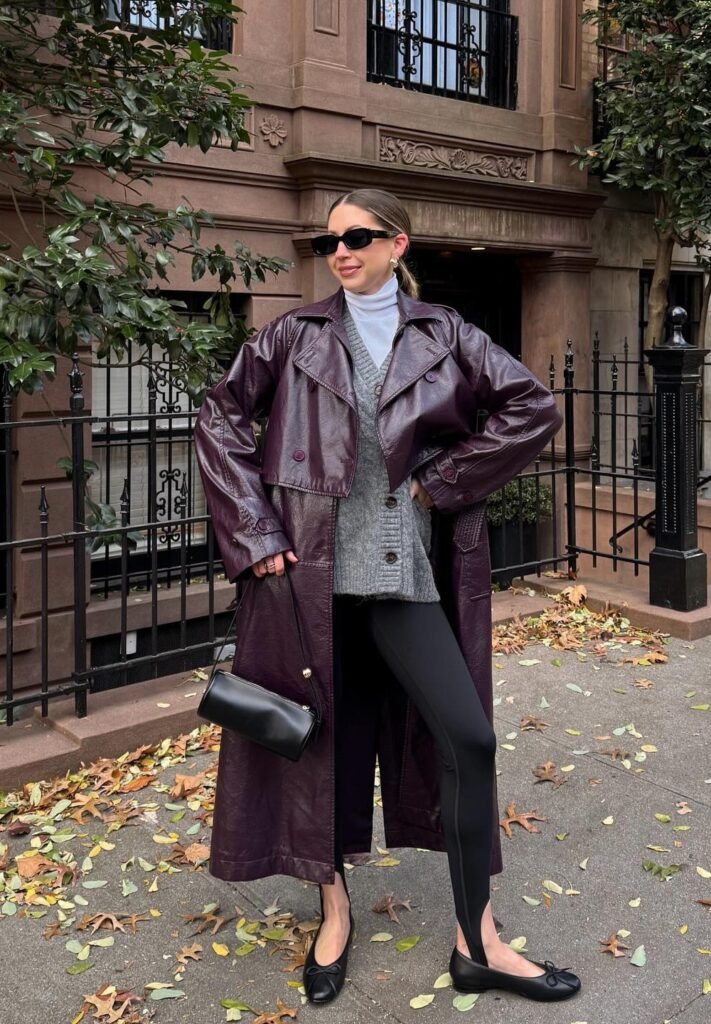 Burgundy Leather Long Coat + Grey Cardigan + White Turtleneck Top + Black Leggings + Black Ballet Flats + Black Mini Shoulder Bag + Sunglasses