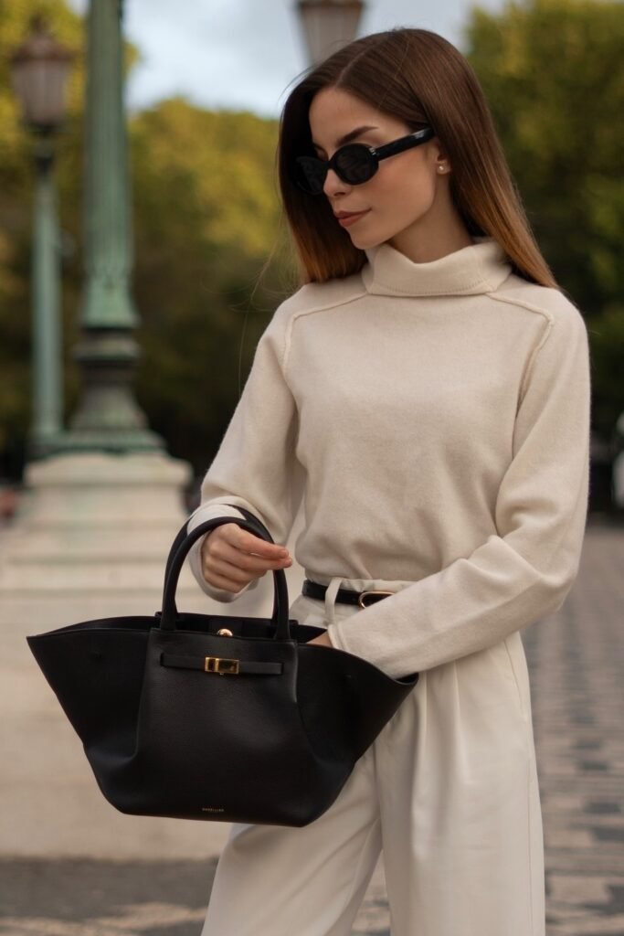 Cream Mock-Neck Sweater + White Wide-Leg Trousers + Black Structured Bag