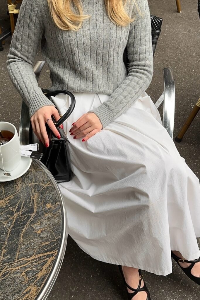 Grey Cable-Knit Sweater + White Maxi Skirt + Black Mini Bag