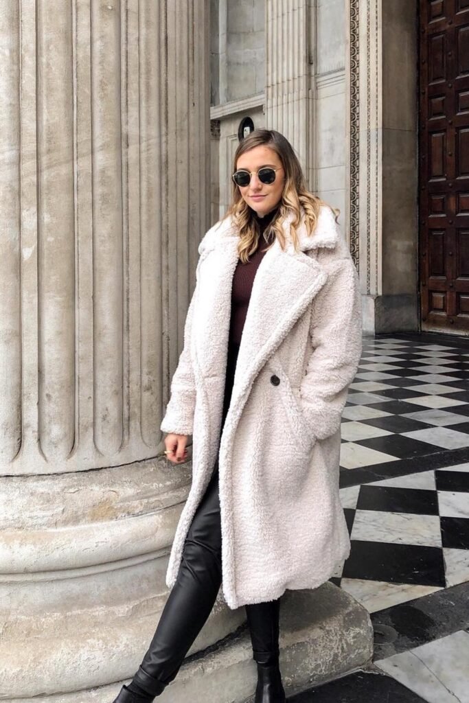 Ivory Teddy Coat + Burgundy Turtleneck + Black Faux-Leather Leggings + Black Chelsea Boots + Round Sunglasses