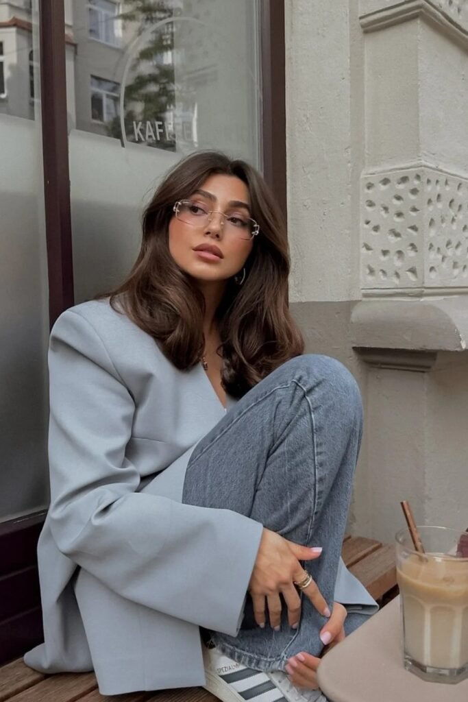 Light Grey Oversized Blazer + Blue Jeans + White Sneakers + Clear Frame Glasses