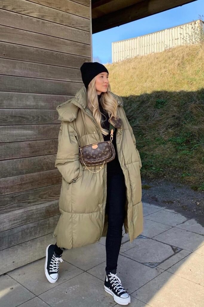 Long Olive Puffer Coat + Black Turtleneck + Black Skinny Jeans