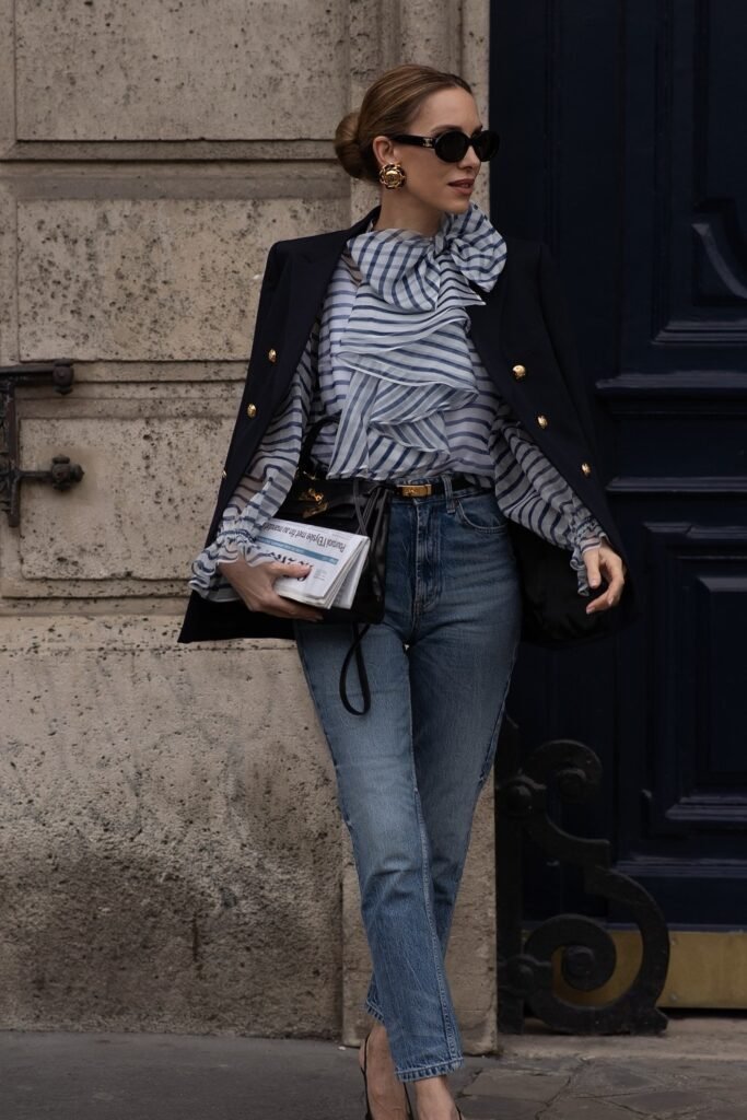Navy Blazer Draped + Blue & White Striped Ruffle Blouse + Blue Straight-Leg Jeans + Black Structured Bag + Black Heels