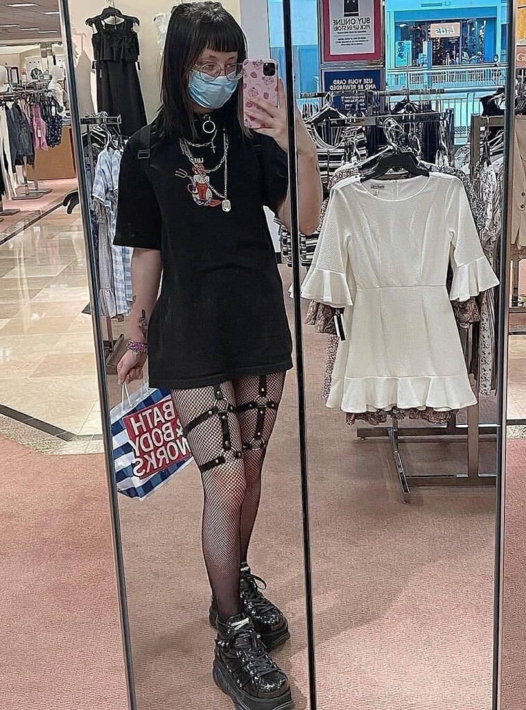 Oversized Black Graphic T-shirt Dress + Fishnet Tights with Harness Straps + Black Platform Sneakers + Layered Chains