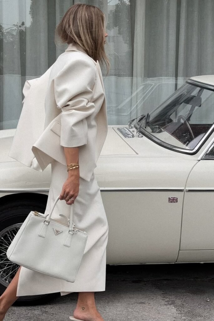 Oversized Cream Blazer + Wide-Leg Cream Trousers + White Prada Tote Bag + Nude Mules