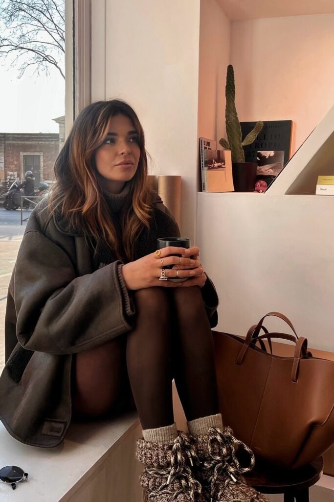 Oversized Dark Shearling Jacket + Grey Turtleneck Dress + Black Tights + Brown Knit Socks + Brown Knit Boots + Brown Leather Tote