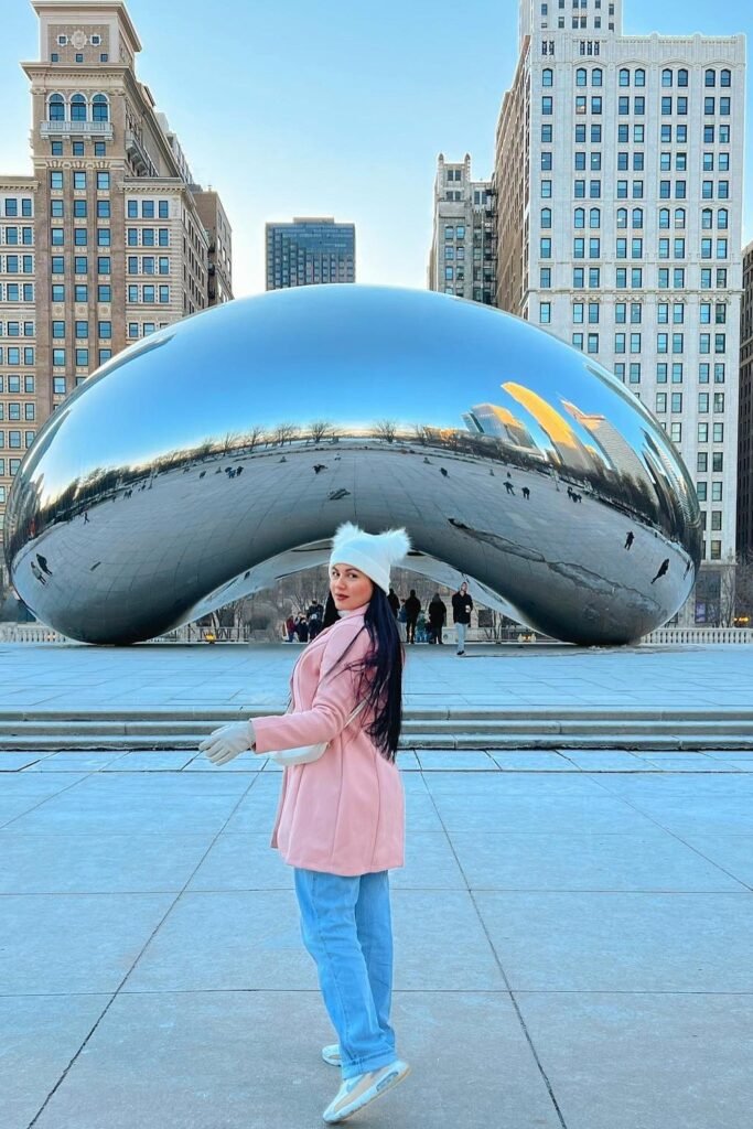 Pink Coat + Blue Jeans + White Sneakers + White Furry Beanie + White Crossbody Bag