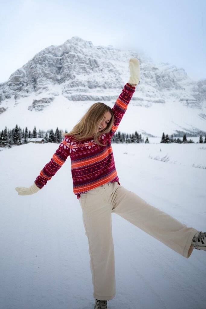 Pink & Orange Fair Isle Sweater + Cream Wide Leg Trousers + Cream Mittens