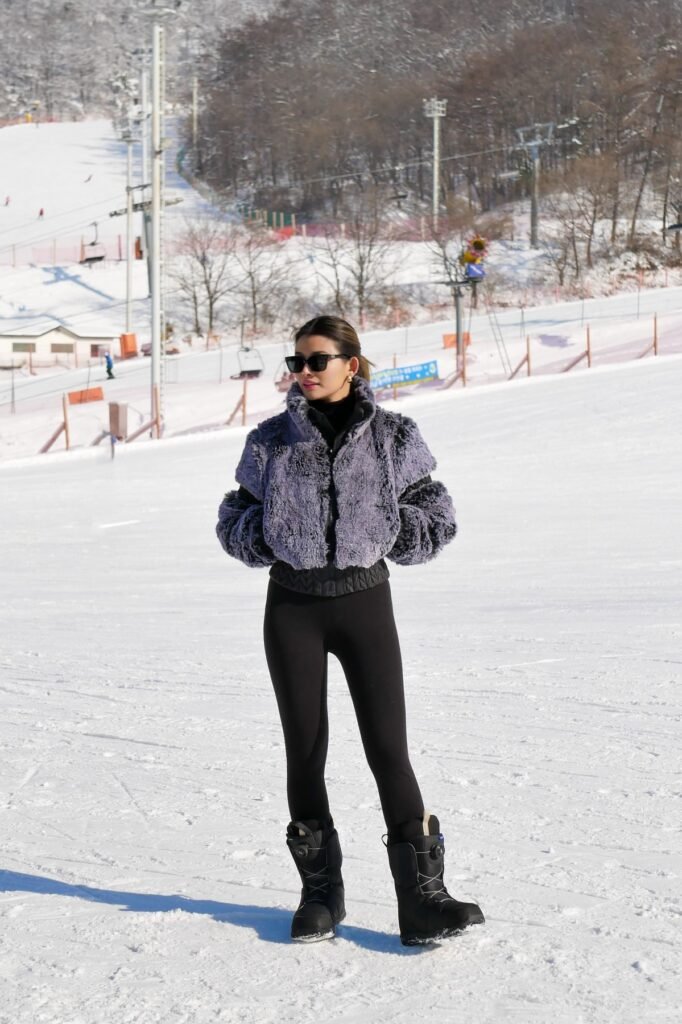 Purple Faux Fur Bomber + Black Leggings + Black Snow Boots