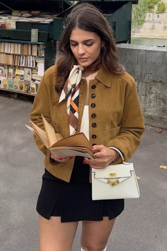Tan Suede Jacket + White Top + Black Mini Skirt + Patterned Silk Scarf + White Structured Bag