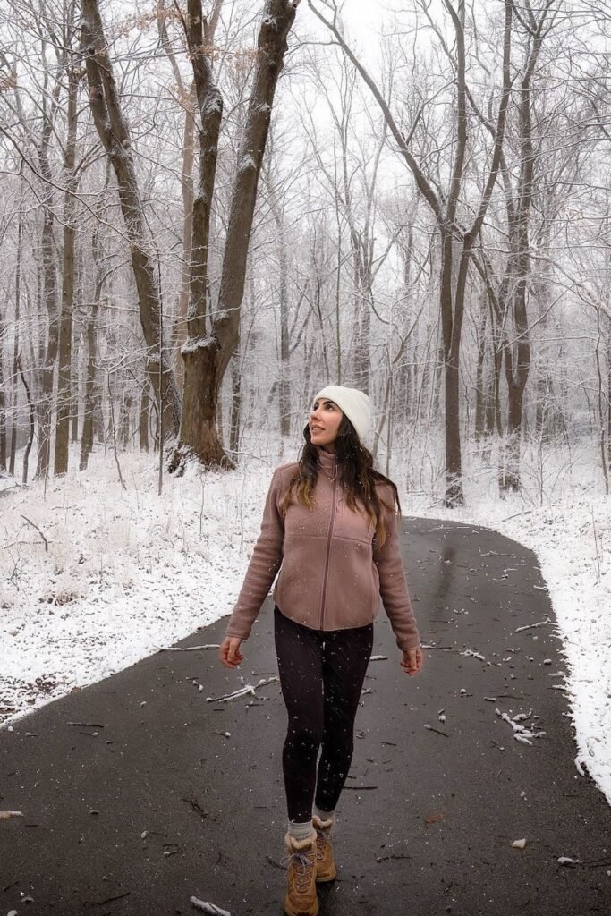 White Beanie + Pink Fleece Jacket + Black Leggings + Brown Lace-Up Winter Boots