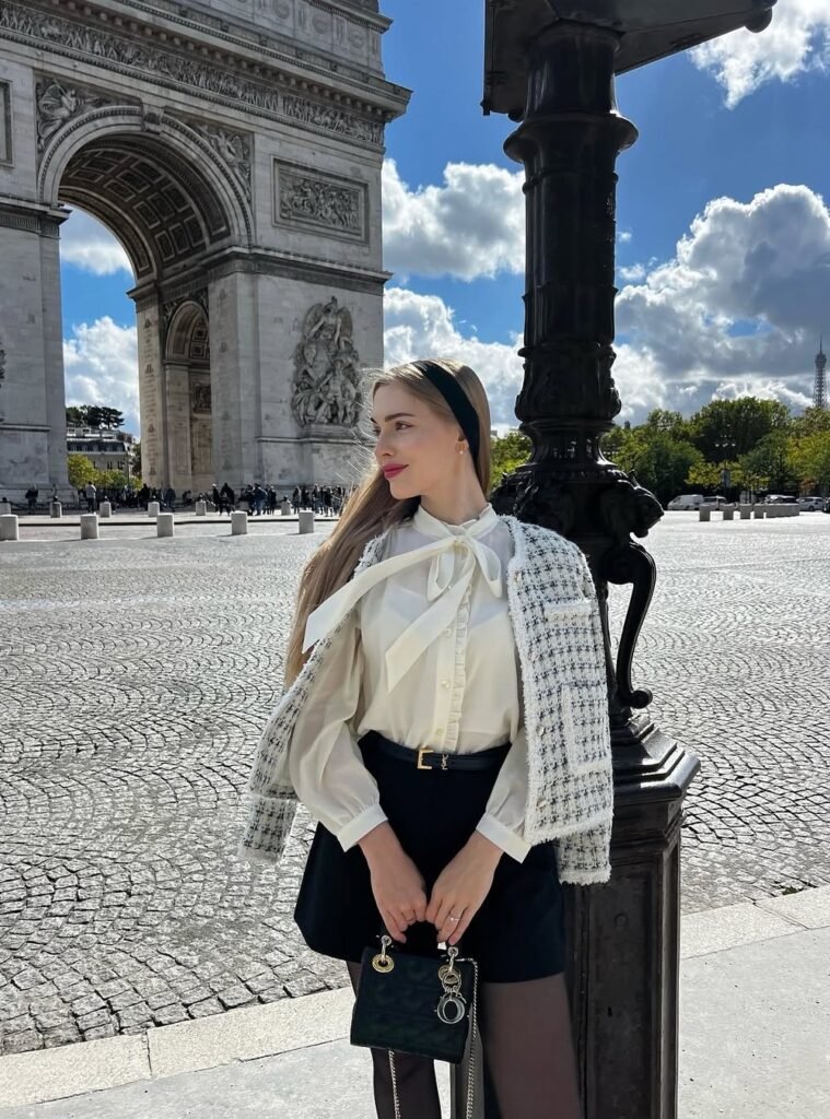 White Bow Blouse + Black High-Waist Shorts + Black Belt + Tweed Jacket Draped + Black Mini Handbag