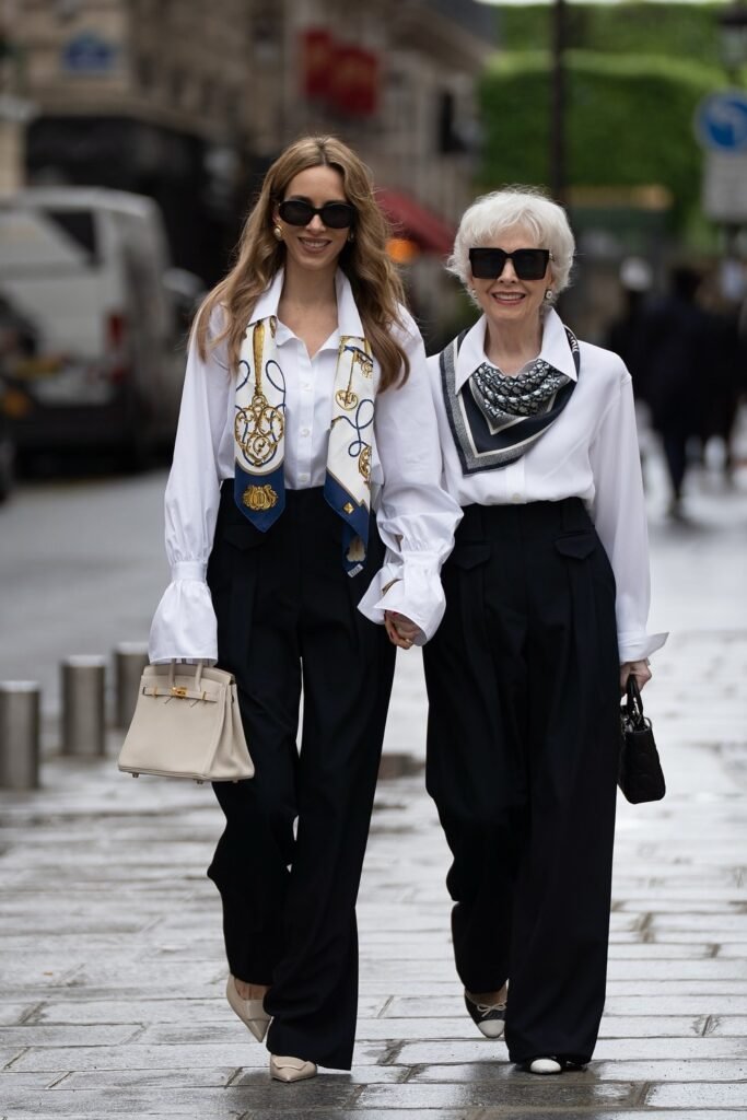 White Button-Up Shirt + Black Wide-Leg Trousers + Printed Silk Scarf + Beige Structured Bag (paired with White Button-Up Shirt + Black Wide-Leg Trousers + Monochrome Silk Scarf + Black Mini Bag)