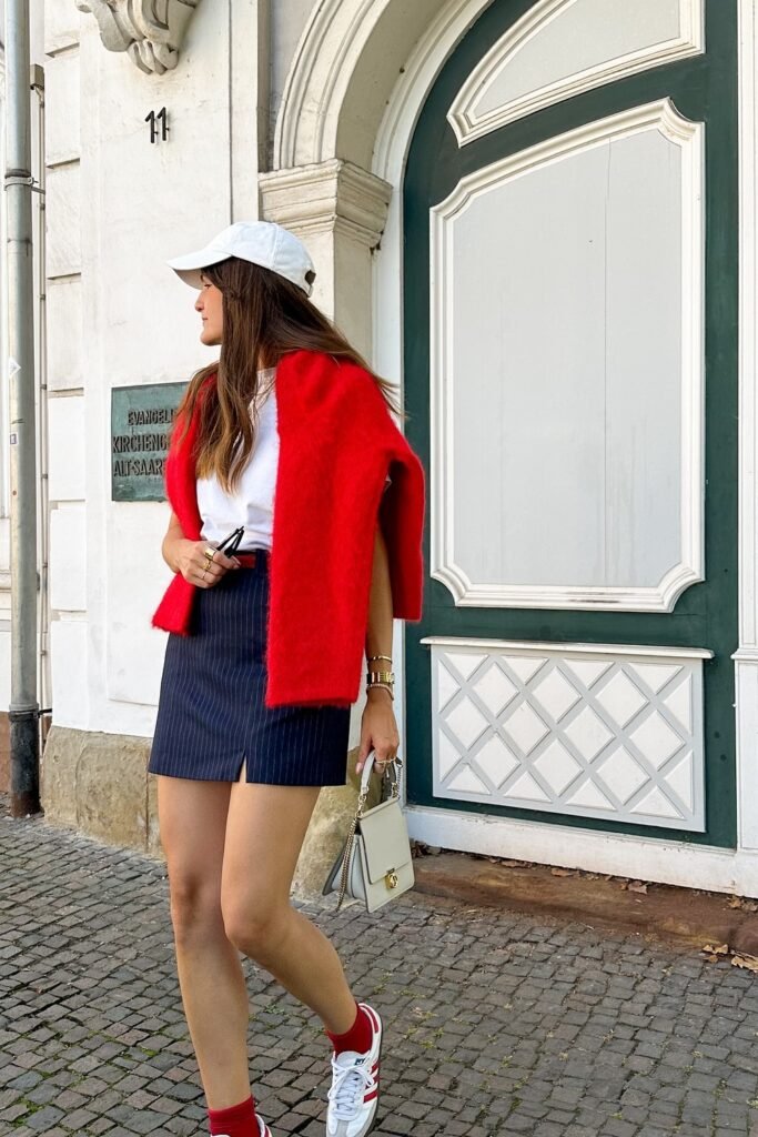 White Cap + White T-Shirt + Red Sweater + Navy Mini Skirt + White Sneakers