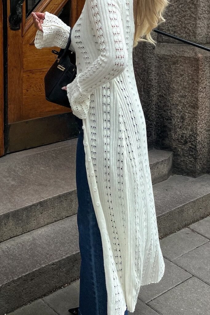 White Longline Knit Cardigan with Button Detail + Blue Jeans + Black Handbag
