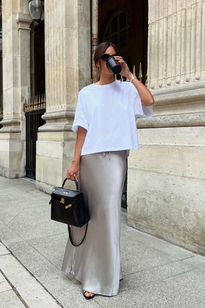 White Oversized T-Shirt + Silver Satin Maxi Skirt + Black Structured Bag + Black Sandals