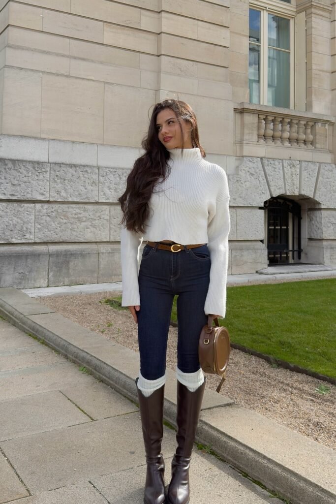 White Ribbed Turtleneck Sweater + Dark Skinny Jeans + Brown Belt + Tall Brown Boots + Round Brown Handbag