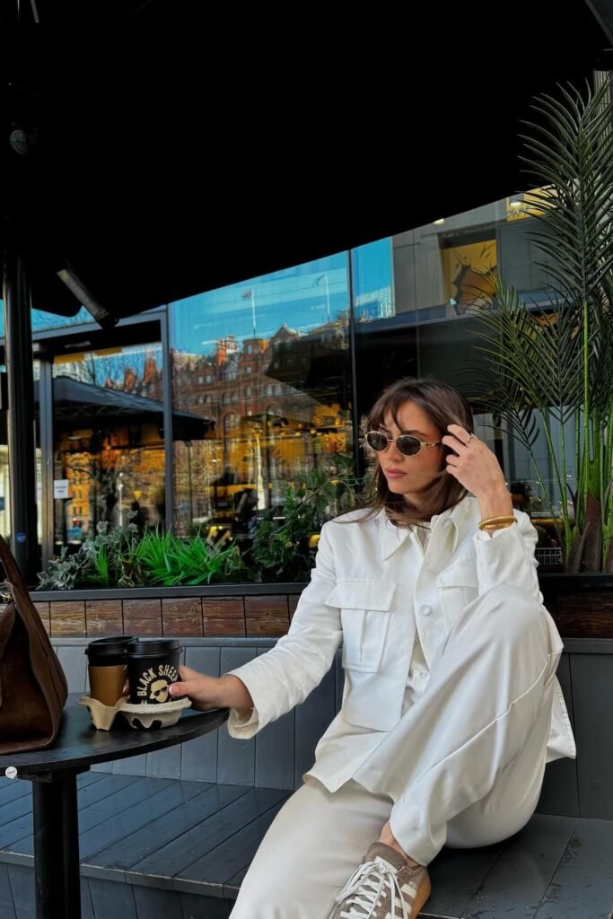 White Utility Jacket + White Wide-Leg Trousers + Taupe Sneakers + Brown Tote Bag