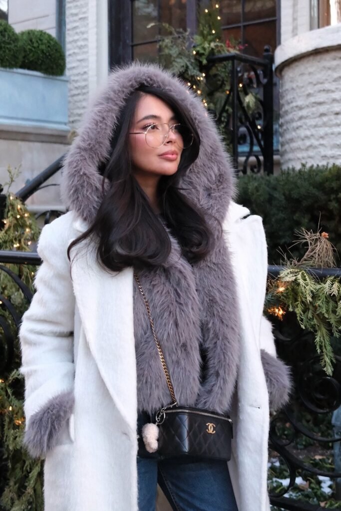 White Wool Coat + Grey Faux Fur Jacket + Blue Jeans + Chanel Crossbody Bag