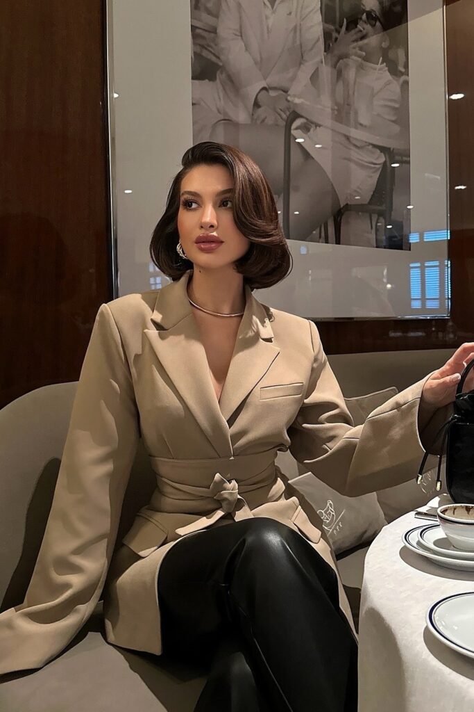 Beige Belted Blazer + Black Leather Pants + Gold Jewelry + Small Black Handbag