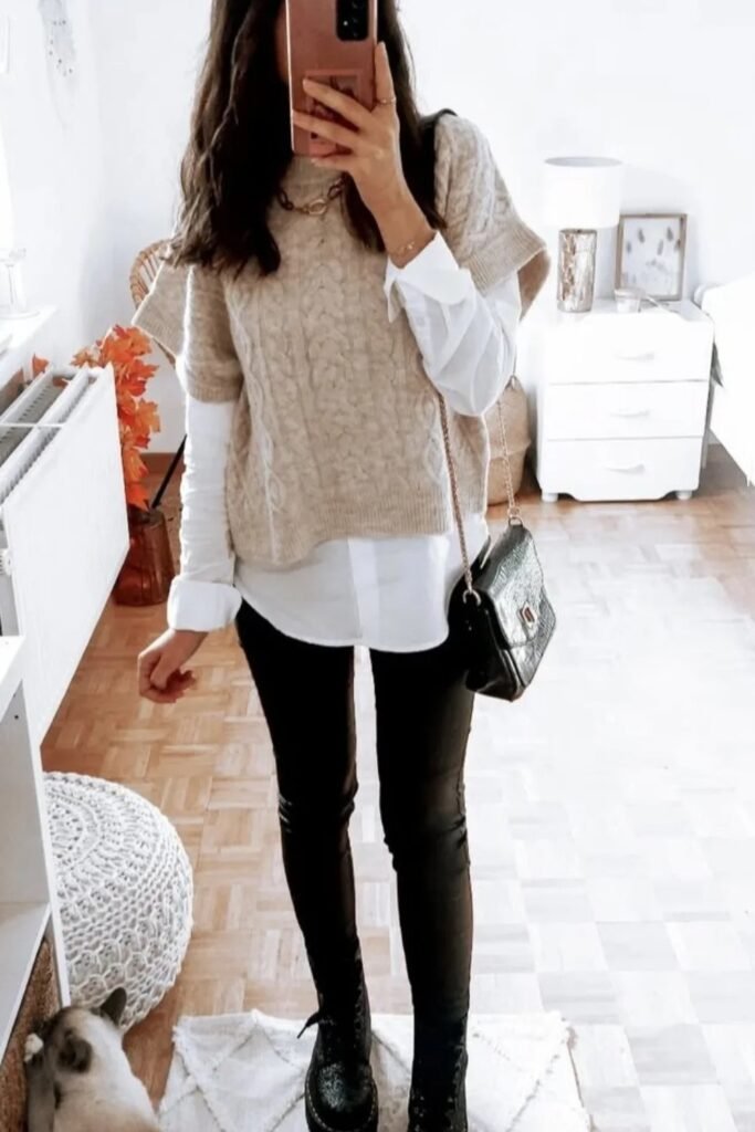 Beige Cable Knit Cap-Sleeve Sweater + White Button-Up Shirt (Layered) + Black Skinny Pants + Black Combat Boots + Black Croc-Effect Crossbody Bag