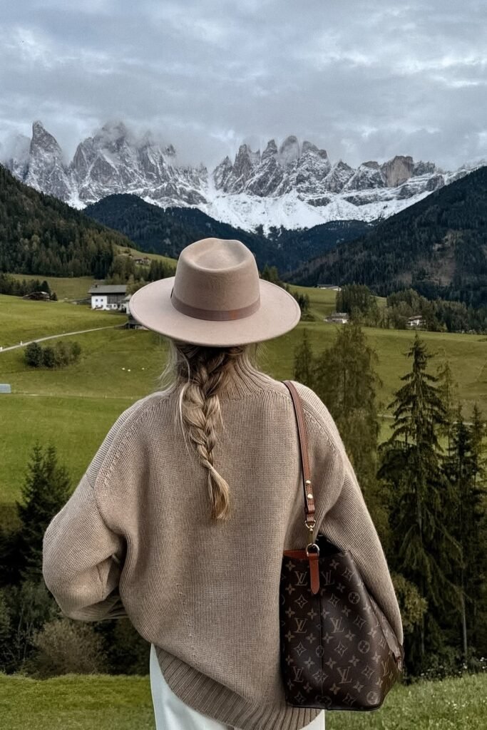 Beige Oversized Knit Sweater + White Trousers + Tan Fedora Hat + Louis Vuitton Shoulder Bag