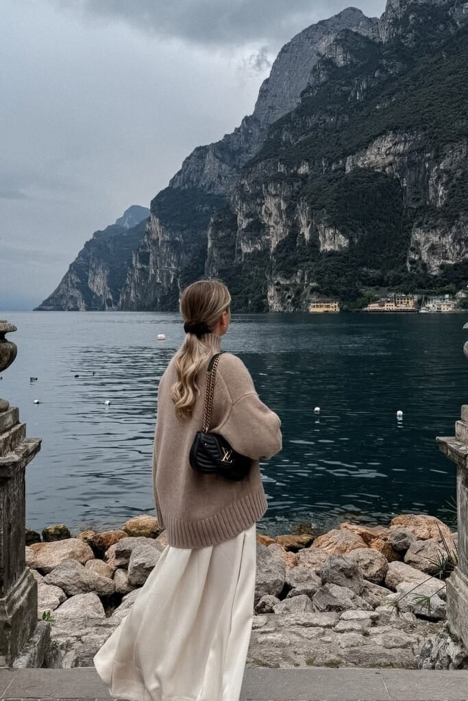 Beige Oversized Turtleneck Sweater + Cream Flowing Skirt + Black Quilted Crossbody Bag