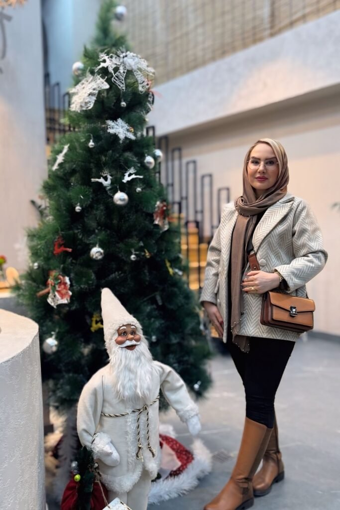 Beige Patterned Jacket + Black Trousers + Tan Knee-High Boots + Brown Scarf