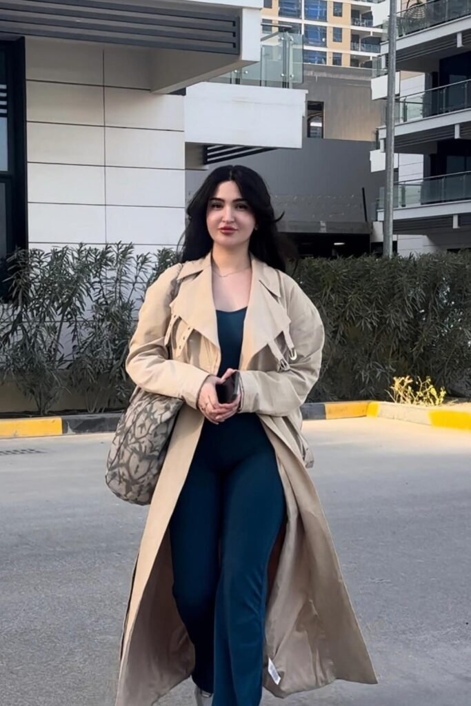 Beige Trench Coat + Teal Jumpsuit + Printed Shoulder Bag