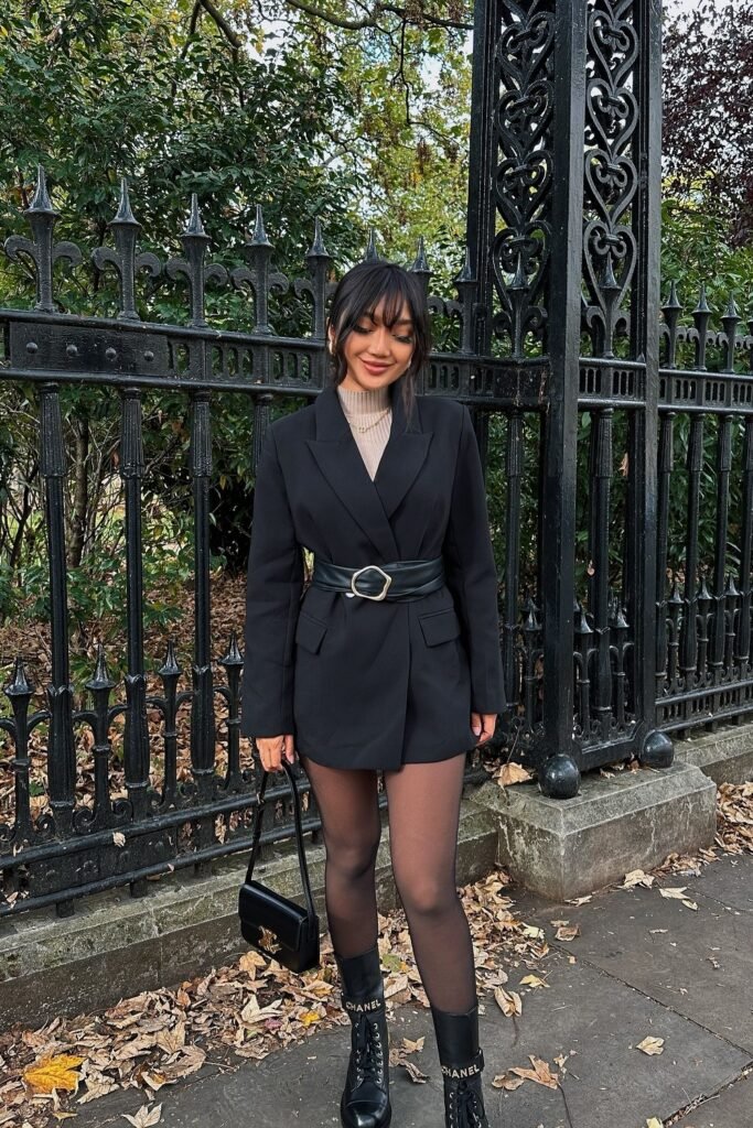 Black Belted Blazer Dress + Beige Turtleneck Top + Sheer Black Tights + Black Combat Boots + Black Handbag