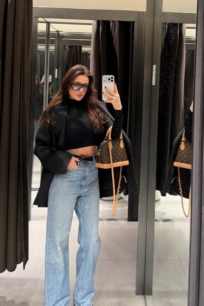 Black Blazer + Black Cropped Turtleneck + Paint-Splattered Wide-Leg Jeans + Louis Vuitton Handbag