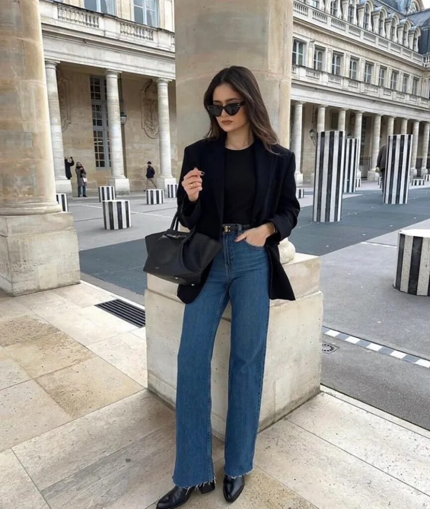 Black Blazer + Black T-Shirt + Medium Wash Wide Leg Jeans + Black Pointed Toe Ankle Boots + Black Top Handle Bag