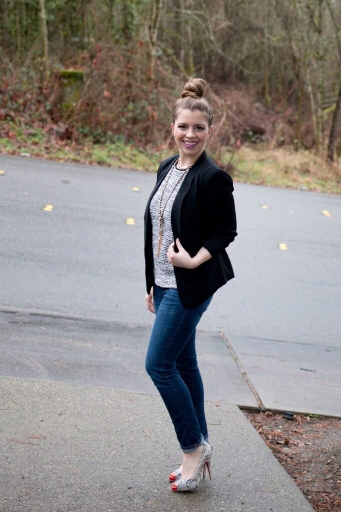 Black Blazer + Black and White Textured Top + Dark Blue Skinny Jeans + Grey Snakeskin Print Heels + Long Gold Necklace