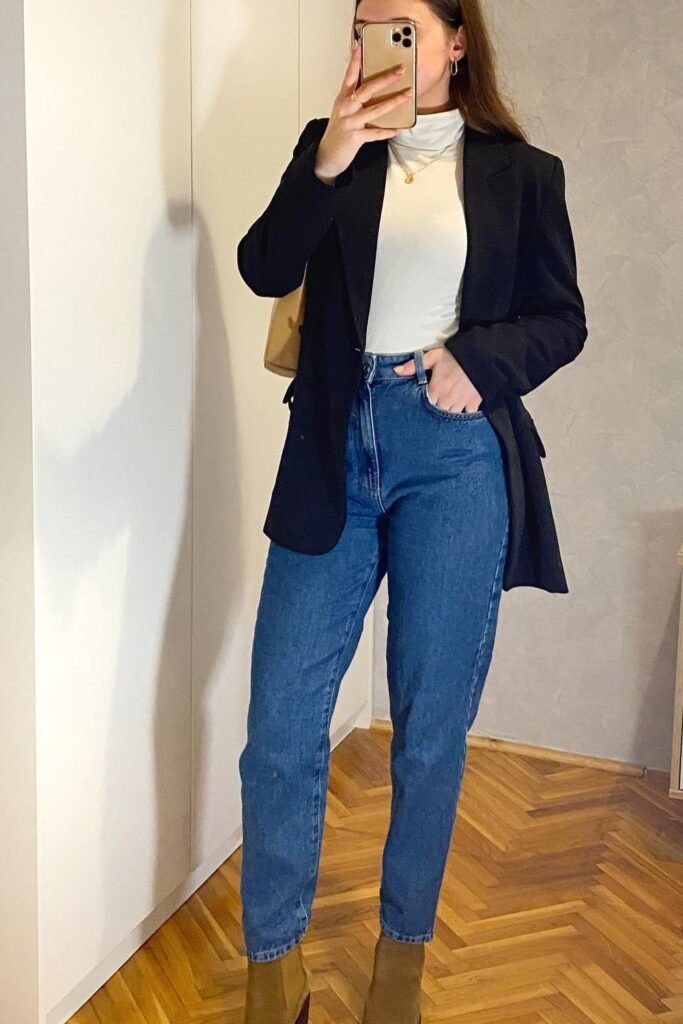 Black Blazer + White Turtleneck Top + Blue Mom Jeans + Brown Ankle Boots + Beige Shoulder Bag