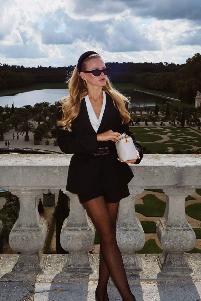 Black Blazer with White Lapel + Black Shorts + Polka Dot Sheer Tights + White Structured Bag + Black Headband