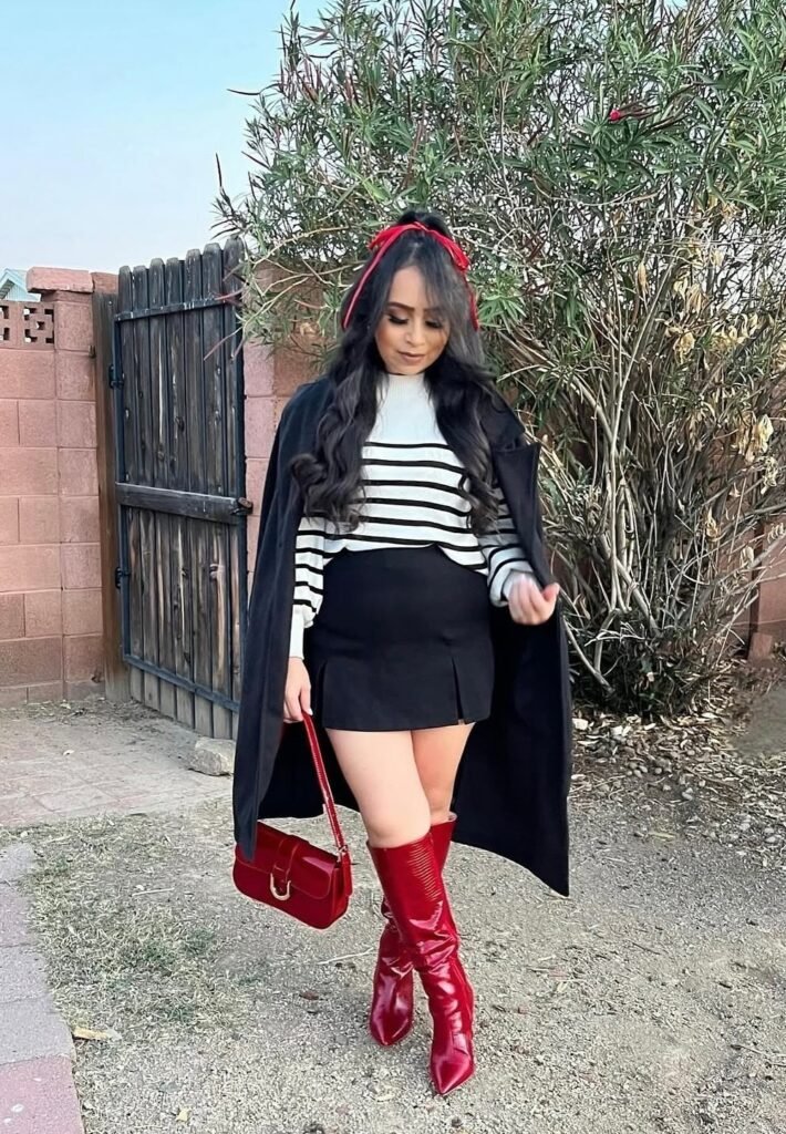 Black Cape Coat + Striped Sweater + Black Mini Skirt + Red Knee-High Boots + Red Handbag + Red Hair Ribbon