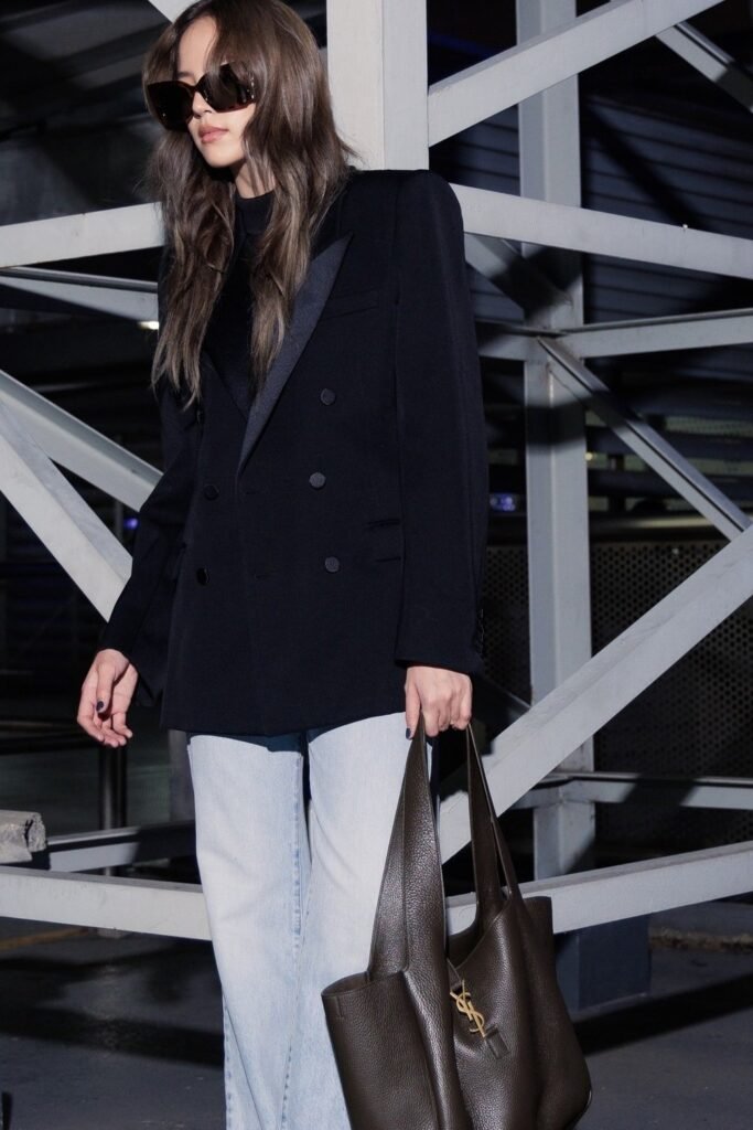 Black Double-Breasted Blazer + Black Top + Light Wash Wide-Leg Jeans + Brown Tote Bag