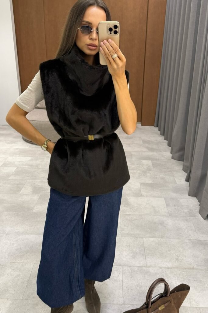 Black Faux Fur Vest with High Collar + Grey T-shirt + Dark Wash Wide-Leg Denim Jeans + Brown Suede Boots