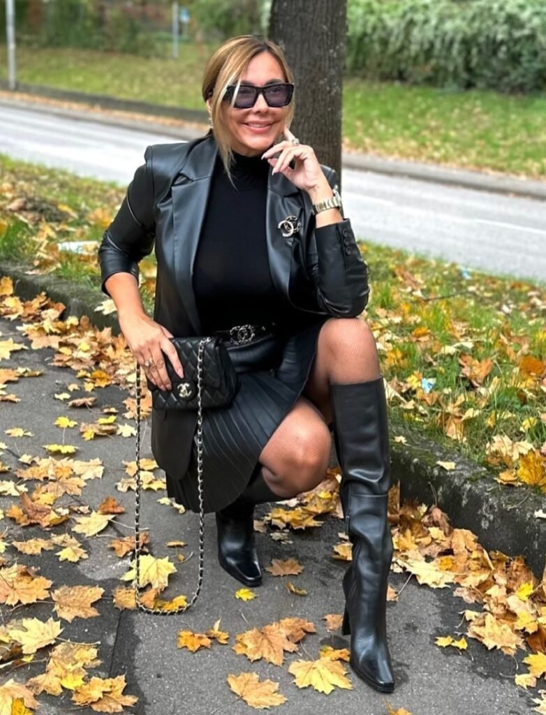 Black Faux Leather Blazer + Black Turtleneck + Black Pleated Faux Leather Mini Skirt + Black Knee-High Boots