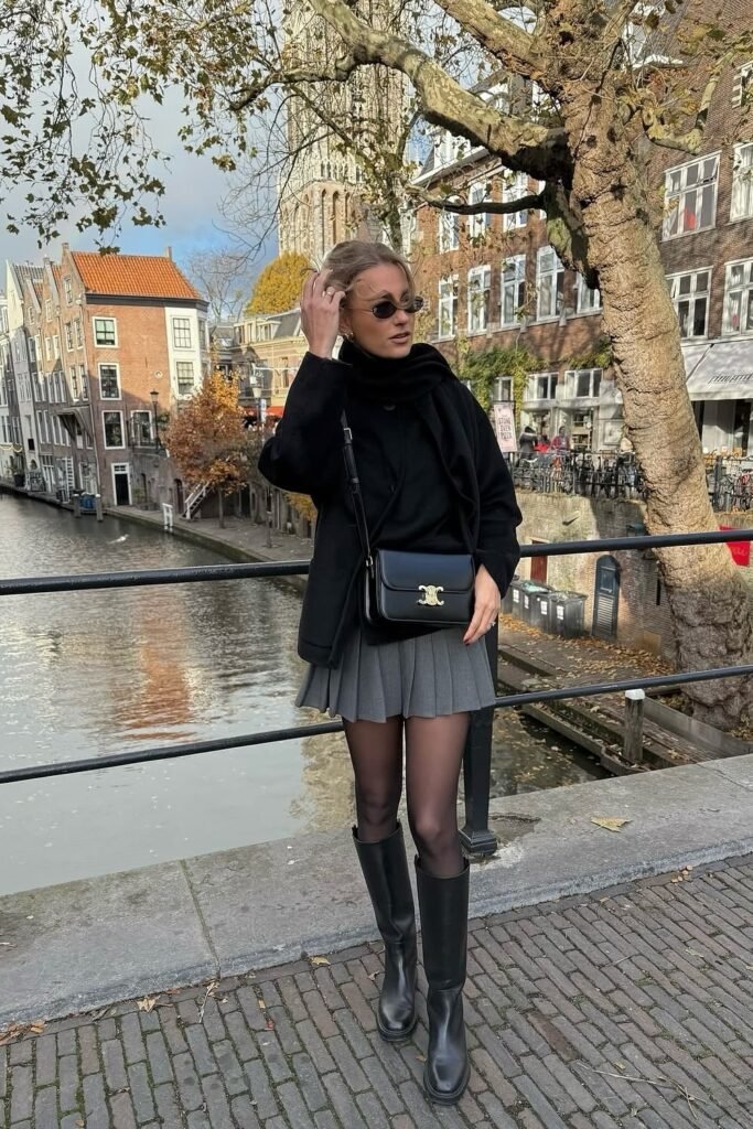 Black Hoodie + Grey Pleated Mini Skirt + Black Knee-High Boots + Black Crossbody Bag