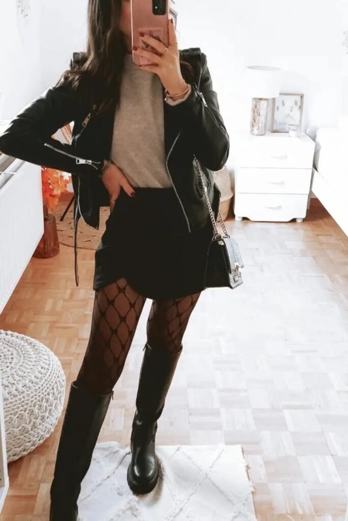 Black Leather Jacket + Gray Turtleneck + Black Mini Skirt + Fishnet Tights + Black Knee-High Lug Sole Boots