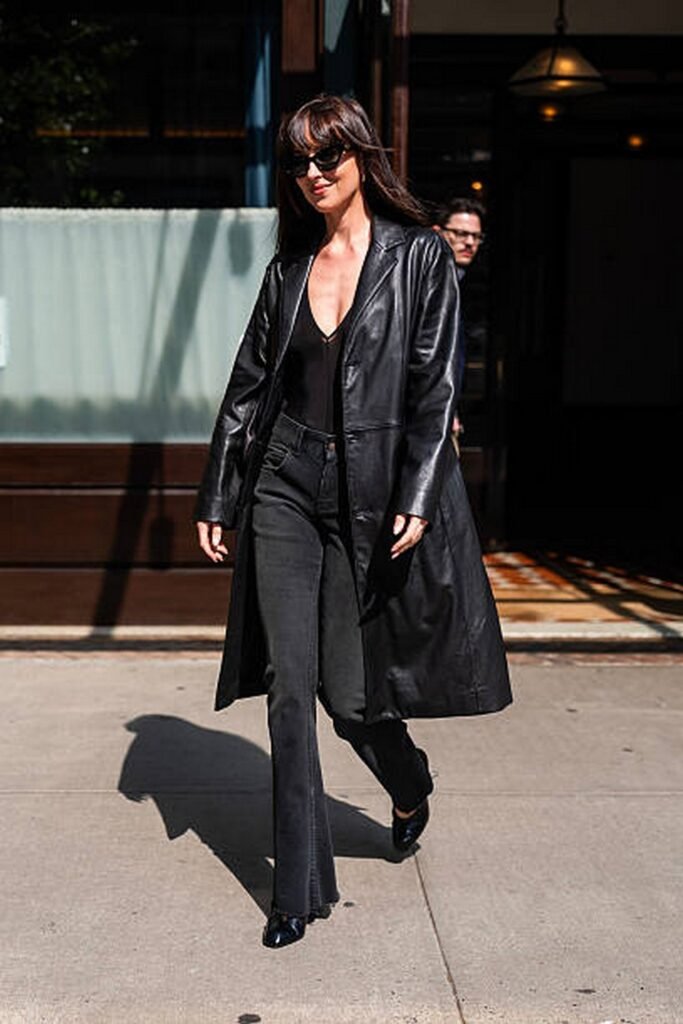 Black Leather Trench Coat + Black V-Neck Bodysuit + Black Flared Jeans + Black Boots